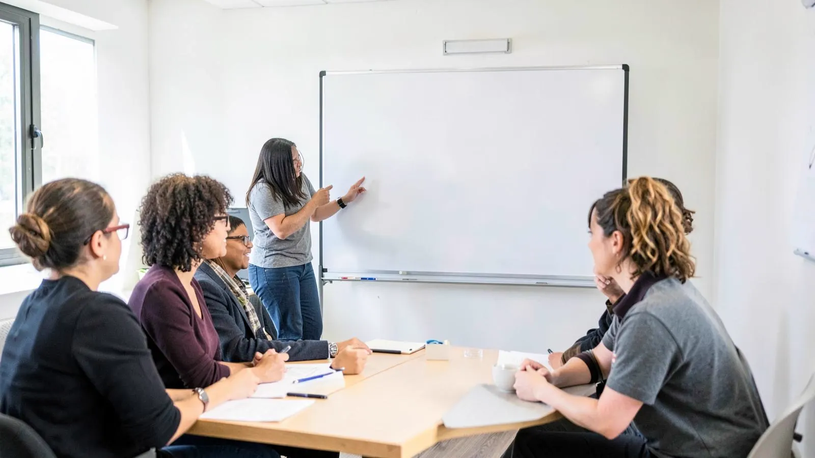 Trainer leading a small business training session in a meeting room